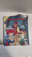 Front cover of Dungeons & Dragons Basic Set box showing dragon and adventurers with a yellow banner indicating inclusion of introductory module.