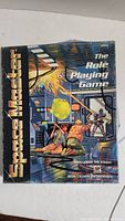Front cover of the Space Master RPG book showing the title, publisher, and cover art.