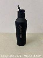 Front view of a black Corkcicle Sports Canteen 32oz bottle with visible logo and straw attached to lid.