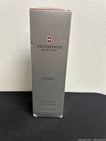 Photo of front of sealed silver box with Victorinox Swiss Army logo and Classic label