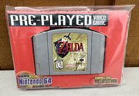 Front view of Nintendo 64 game cartridge in red pre-played packaging, showing the label and general condition.