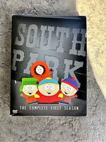 Front view of the South Park Season 1 DVD box showing characters Kenny, Kyle, Cartman, and Stan and title