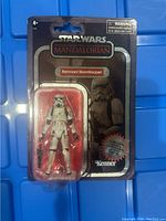Full view of the mint on card Star Wars Mandalorian Remnant Stormtrooper action figure with carbonized label.