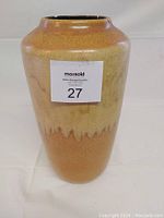 Front view of ceramic vase showing the full shape and glaze color.