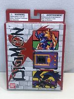 Photo of the front of the unopened boxed Digimon virtual pet by Bandai.