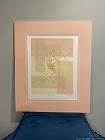 Full view of framed vintage art print featuring abstract orange optic design set against a peach matte.