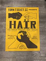 Full view of 'Hair' musical poster with illustrated hands and text