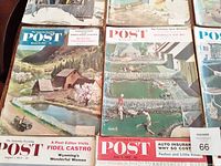 Photo showing 6 Saturday Evening Post magazine covers laid out, including a rural cabin by a river and a swimming pool scene.