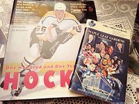 Hockey book and Maple Leaf Gardens 1981-1982 Fact Book side by side showing cover illustrations and titles.