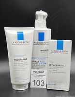 Front view of all three La Roche-Posay products - Toleraine Caring Wash 200ml, Lipikar Baume AP+M 400ml, Effaclar Mat 40ml, all sealed and with brand labeling visible.