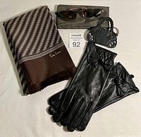 Photo showing all items in the lot including the gloves, scarf, handbag keychain, and sunglasses laid out on a white surface with a MaxSold lot tag visible.
