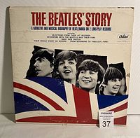 Front cover of The Beatles' Story 2 LP set showing the Union Jack and images of the band members.