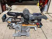 Full side view of the Mastercraft Maximum 10-inch sliding mitre saw on a paved surface.