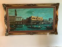 Full view of the oil painting showing Venice canal scene with gondolas, including the gold gilt frame and red velvet matting.