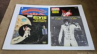 Four Elvis Presley vinyl record jackets laid flat showing front cover artwork.