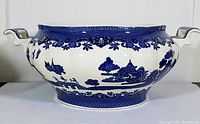 Front view of the blue Willow jardinere showing overall shape, handles, and pattern details.