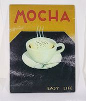 Front side of the glass cutting board featuring the vintage mocha coffee cup design with the words 'MOCHA EASY LIFE'.