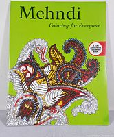 Front cover of Mehndi coloring book by Skyhorse Publishing showing colorful Mehndi designs on a green background and stating it is a fun antistress coloring book.