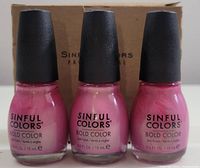 Front view showing three identical bottles of Sinful Colors nail polish in pink shades with black caps and box behind.