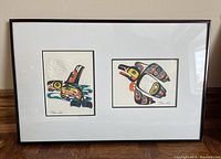 Full view of framed artwork containing two prints side by side in one 12x18 frame with white matting and black frame.