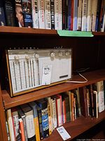 Front view showing vertical frequency scales, control knobs and speaker grill