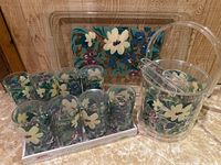 Photo of full set showing tumblers, ice bucket with tongs, and serving tray with floral design.