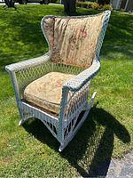 Front-right angle showing overall design, cushions, and wicker pattern