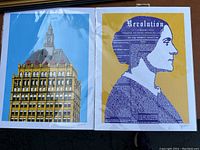 Pair of signed art prints in plastic sleeves. Left print is a stylized profile of Susan B Anthony with text; right print shows Kodak Tower building with red KODAK logo.