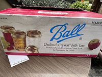 Closed original cardboard box labeled Ball Quilted Crystal Jelly Jars with images of jars filled with food.