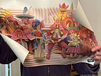 Unrolled paper art illustration of colorful figures held by hands