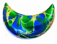 Front view of crescent-shaped mid century copper brooch with hand painted enamel in blues and greens with gold accents.