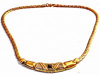 Full view of the vintage flex coil necklace laid flat, showing overall shape and clasp.