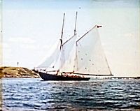 Close-up of the painting depicting the sailing ship on the water.