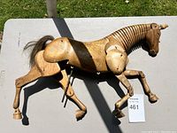 Overhead view of full wooden horse laid on table