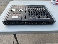 Top and angled view showing left side inputs and control knobs of the Tascam DP-02 Portastudio