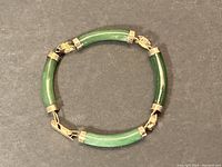 Closed view of bracelet in circular form showing shape, color and link arrangement