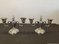 Front view of both candleholders side by side on table