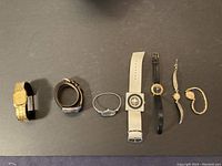 Full view of all seven women's watches arranged in a line showing styles and bands