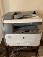 Front view showing the Canon imageRUNNER 1025iF multifunction printer with keypad, display, and document feeder see markings and model name.
