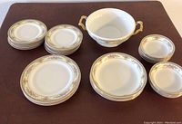 Shows the arrangement of plates and bowls including the two handled soup bowl and different sized plates.