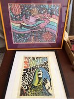 Photo showing both posters side by side; Janis Joplin concert poster below and Miss Neptune 2004 psychedelic print above, framed and matted.