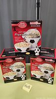Photo of three boxed Betty Crocker Hot Air Popcorn Makers with soccer ball themed design.