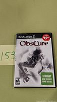 Front cover of PlayStation 2 game Obscure showing ghostly figure and game rental sticker.
