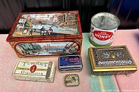 Full lot of six vintage tins including large decorated Dresden cookie tin, Pure Canadian Honey tin, Turret Cigarettes tin, small decorative tins with scenic and patterned lids.
