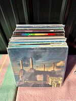 Stack of vintage vinyl records front cover showing Pink Floyd - Animals album with Battersea Power Station artwork.