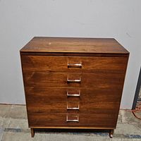 Front view showing five drawers and chrome pull handles