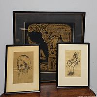 Three framed artworks shown together, including the Thai style rubbing and two sketches.