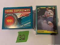1991 Score Young Superstars hockey card box next to protective card case with Eric Lindros card