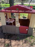 Front and side view showing mailbox, countertop with sink, entrance doors.