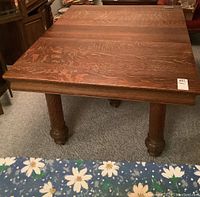 Full view top showing rectangular oak tabletop with two leaves inserted